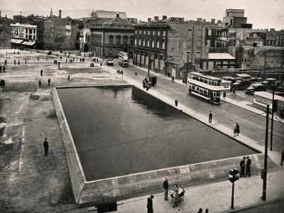 A static reserve water tank constructed at a cleared bomb site on Bridge Street