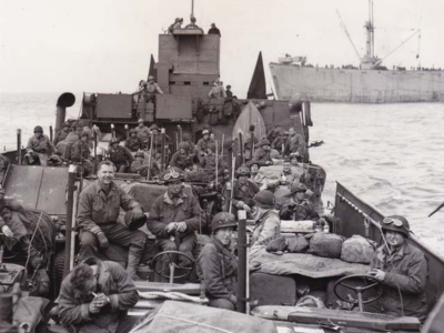 Division Jeeps being taken ashore in France.