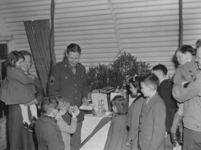 Presents being distributed to local children at a Christmas party.