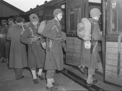 Men boarding a train during exercise JALOPY.