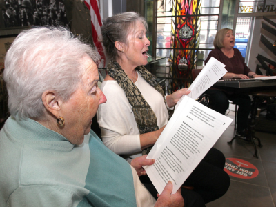 A dementia friendly Sing for Victory Workshop in the museum gallery