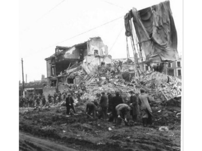 Destroyed houses at Hillman Street with the canopy of a parachute mine draped over telephone wires - NIWM Collection