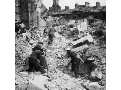 ARP crew work in the rubble of houses in Eglinton Street - Imperial War Museums