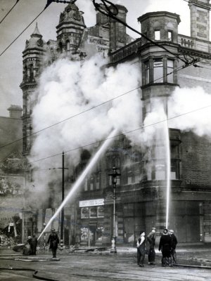 Fire crews train their hoses on the Imperial Buildings, High Street - Belfast Telegraph